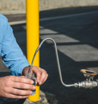 Image of a water quality sample being collected.