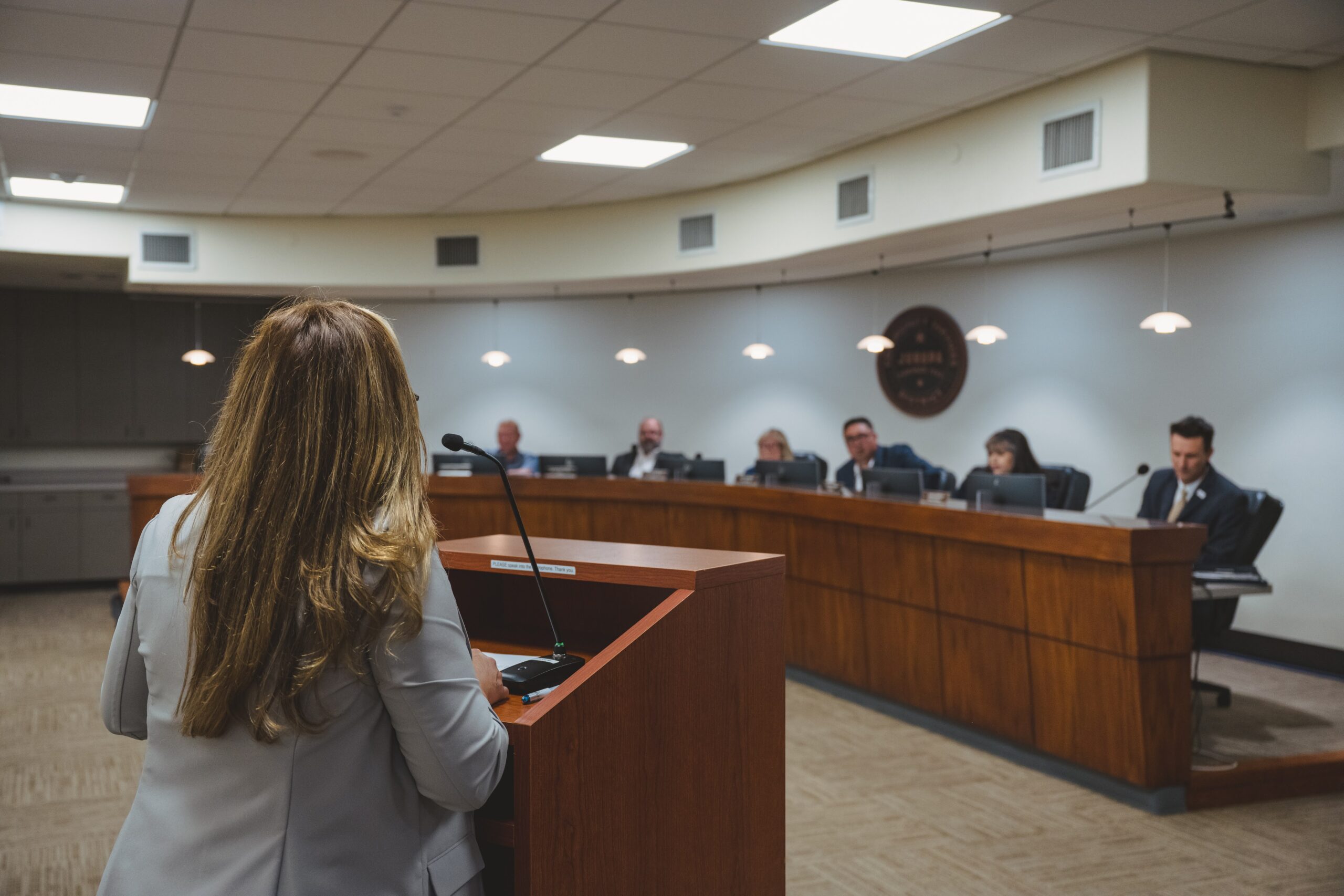 Person speaking in front of JCSD Board of Directors