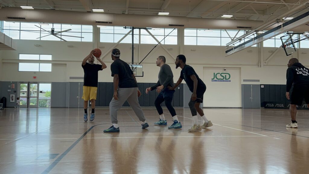 Group of people playing basketball