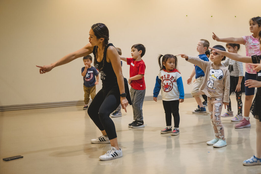 Dance teacher instructing children