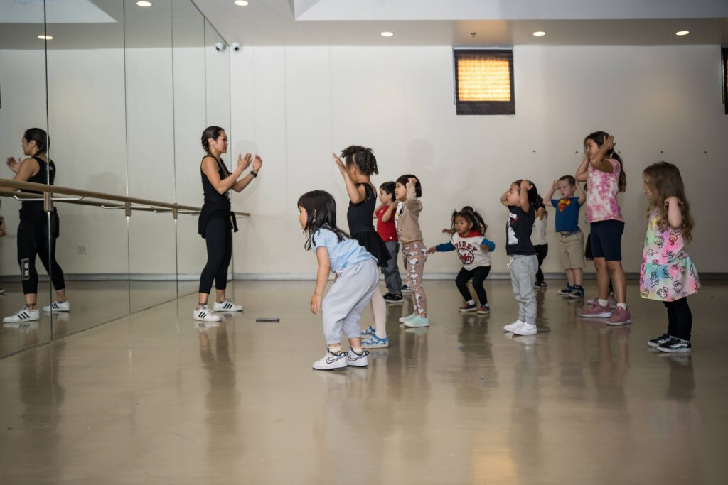 Dance instructor teaching children