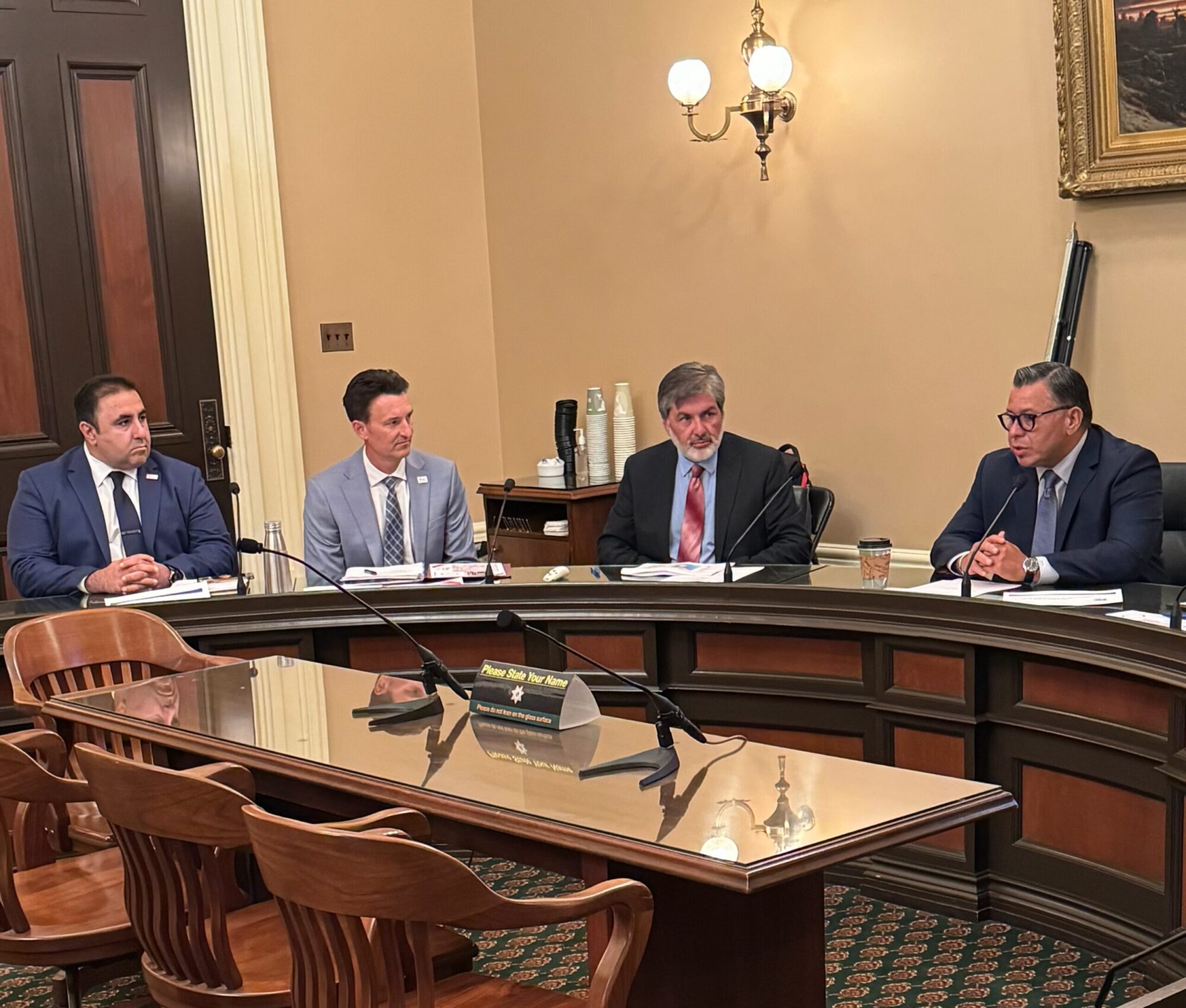 Four people sitting around table JCSD Among Select Leaders to Participate in PFAS Mitigation Roundtable at the State Capitol